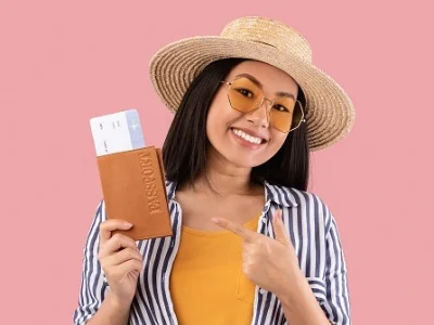 asian-woman-holding-and-pointing-at-passport-with-WEBP.webp